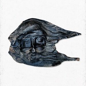 6384. Damaged Leather Weird Face Brooch
